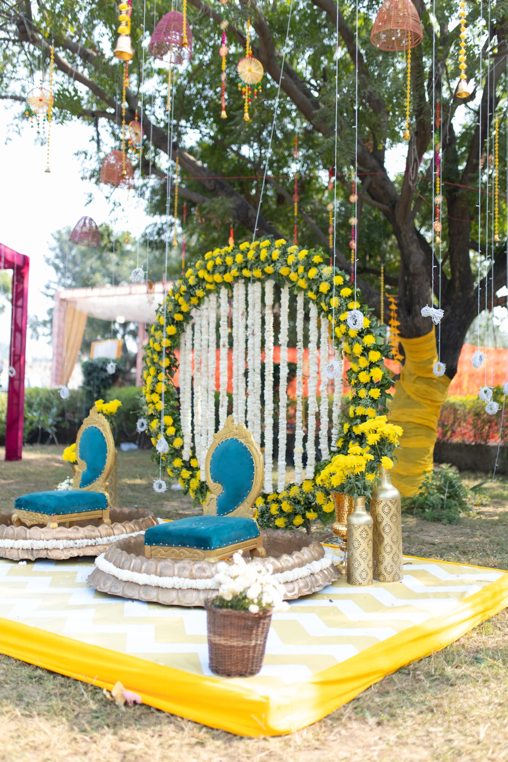 Bright outdoor wedding setup featuring colorful floral decorations and elegant seating.
